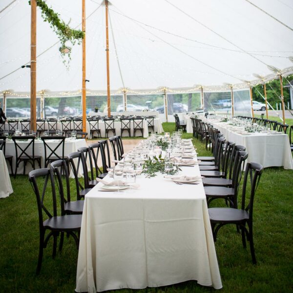 outdoor wedding in the berkshires sailcloth tent rental with black cross back chairs