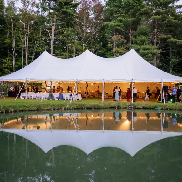 large standard pole tent with folding tables and garden chairs for a wedding in the berkshires